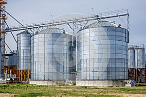 silos granary elevator on agro-industrial complex with seed cleaning and drying line for grain storage photo