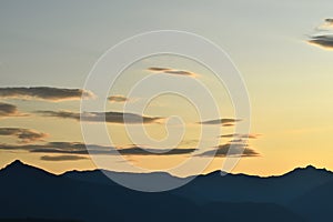 silouette of mountains of the alps in the dawn with copy space