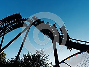 SIlouette people having fun rollercoaster ride