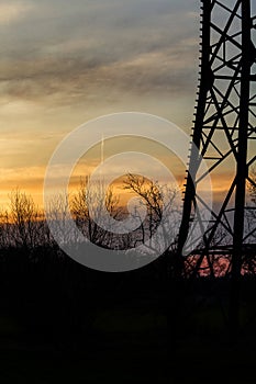 Silouette of a power pole in the blue twilight