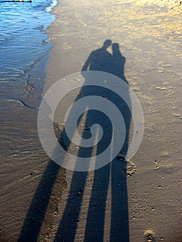 Silouette shadows in the sand photo