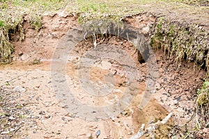 Silt eroding along creek