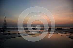 Siltation in the river Ganges near the Bay of Bengal at the time of twilight.