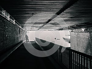 Female silhouette in tunnel, no color photo
