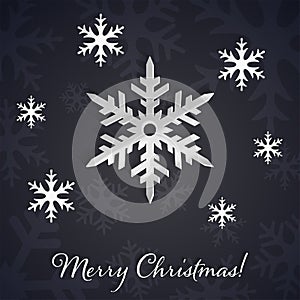 Silver 3D snowflakes on the dark winter and New Year background with snowflake silhouettes.