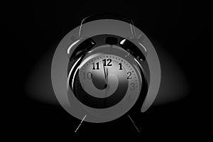 Silver alarm clock on black background. 3d rendering
