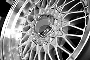Silver alloy wheels on a car, close-up. Purchase and replacement of autodisks