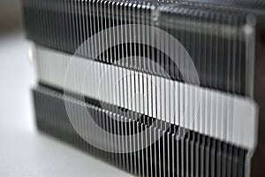 Silver aluminum CPU radiator with copper cooling tubes close-up