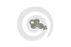 A silver, antique briefcase key isolated on a white background
