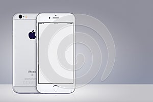 Silver Apple iPhone 7 mockup front and back side on gray background with copy space