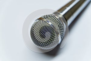 Silver audio microphone on white background