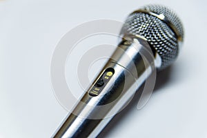 Silver audio microphone on white background