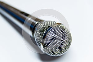 Silver audio microphone on white background