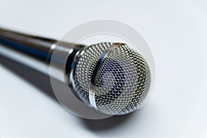 Silver audio microphone on white background