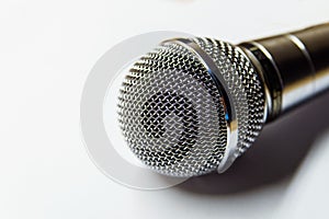 Silver audio microphone on white background