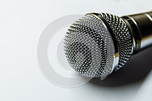 Silver audio microphone on white background