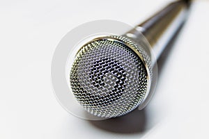 Silver audio microphone on white background