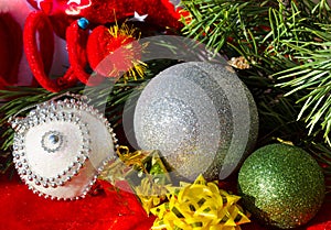 Silver ball, bows and stars, on a red background. Decorations for the New Year and Christmas