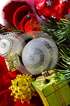 Silver ball, bows and stars, on a red background. Decorations for the New Year and Christmas