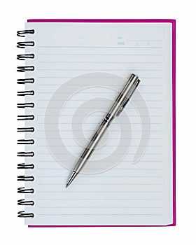 Silver ball point pen on pink notebook