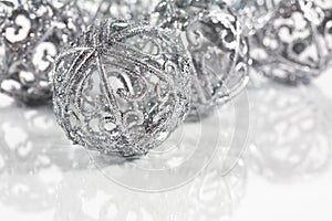 Silver balls on white background