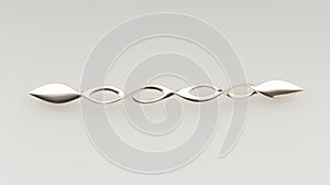 A silver barrette with a wave-like design. photo