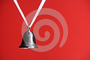 Silver Bell on Red