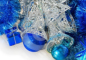 Silver bells and blue Christmas tree decorations. Decorations for the New Year and Christmas