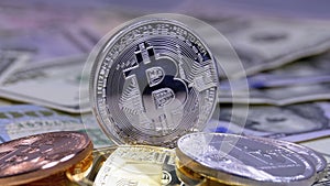 Silver Bitcoin Coin, BTC and Bills of Dollars are Rotating
