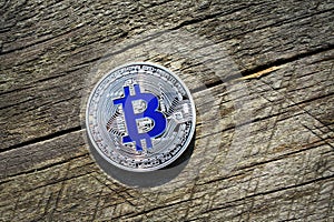 Silver Bitcoin on a Wood Macro shot.BTC