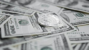 Silver Bitcoins on US dollars. Digital currency close-up. Virtual money. Crypto currency. Metal coins of bitcoins on