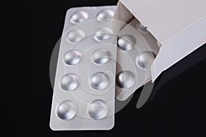Silver blister pack of small pills