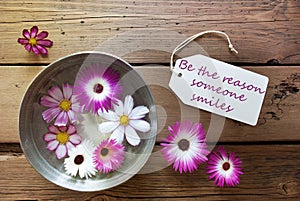 Silver Bowl With Cosmea Blossoms With Life Quote Be The Reason Someone Smiles photo