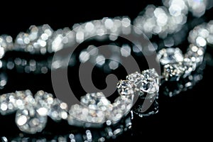Silver bracelet with diamonds on a black background