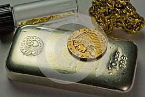 Silver Bullion Bar, Gold Coin and Gold Nuggets