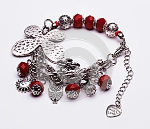 Silver butterfly bracelet with red gems