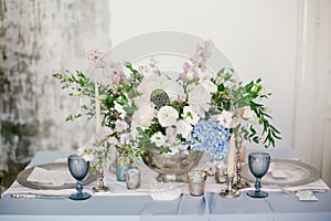 Silver candlestick as element of festive table wedding decorations.