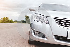 Silver car parking on the road