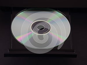 Silver CD or DVD in an Ejected Tray of a Multimedia Player