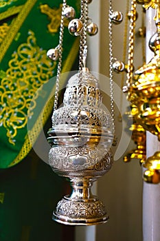 A silver censer or censer, an ecclesiastical object used in the Orthodox or Catholic liturgy.