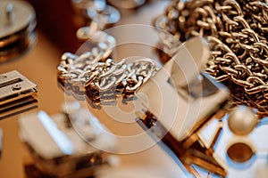 Silver chain with closures for handbags on a mirror plate