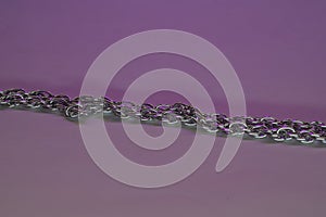 Silver chain for costume jewelry as a background image with copy space photographed