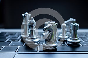 Silver chess on laptop, Marketing or business strategy, Chess battle victory success, Team leader teamwork business strategy,