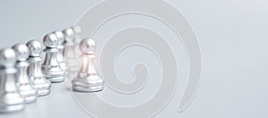 Silver chess pawn pieces or leader businessman stand out of crowd people of men. leadership, business, team, teamwork and Human