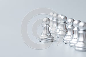 Silver chess pawn pieces or leader businessman stand out of crowd people of men. leadership, business, team, teamwork and Human