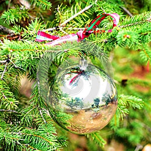 Silver Christmas ball with checkered ribon