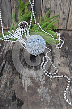 Silver Christmas ball on wooden background