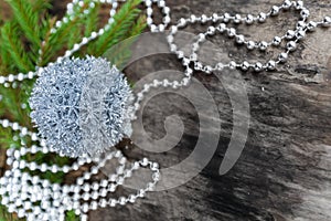 Silver Christmas ball on wooden background