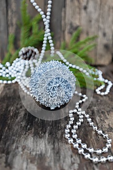 Silver Christmas ball on wooden background