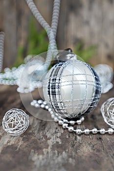 Silver Christmas ball on wooden background